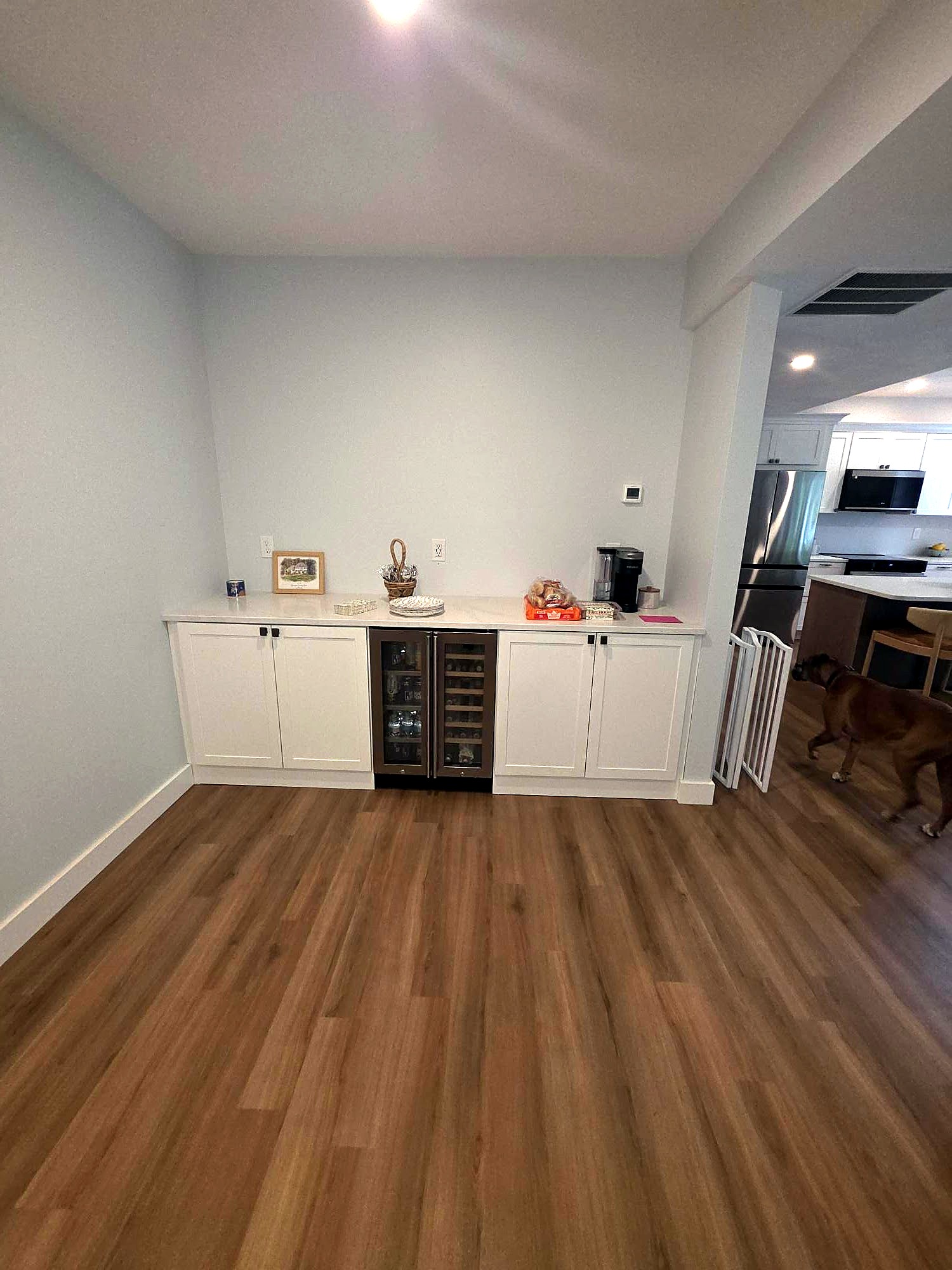 White built-in cabinetry with open shelves and lower storage